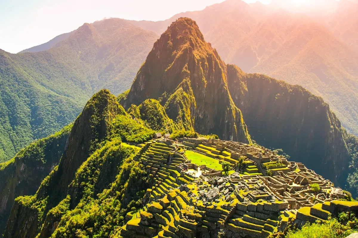 Machu Picchu, Peru — classic view of Inca stone terraces in warm morning sunlight