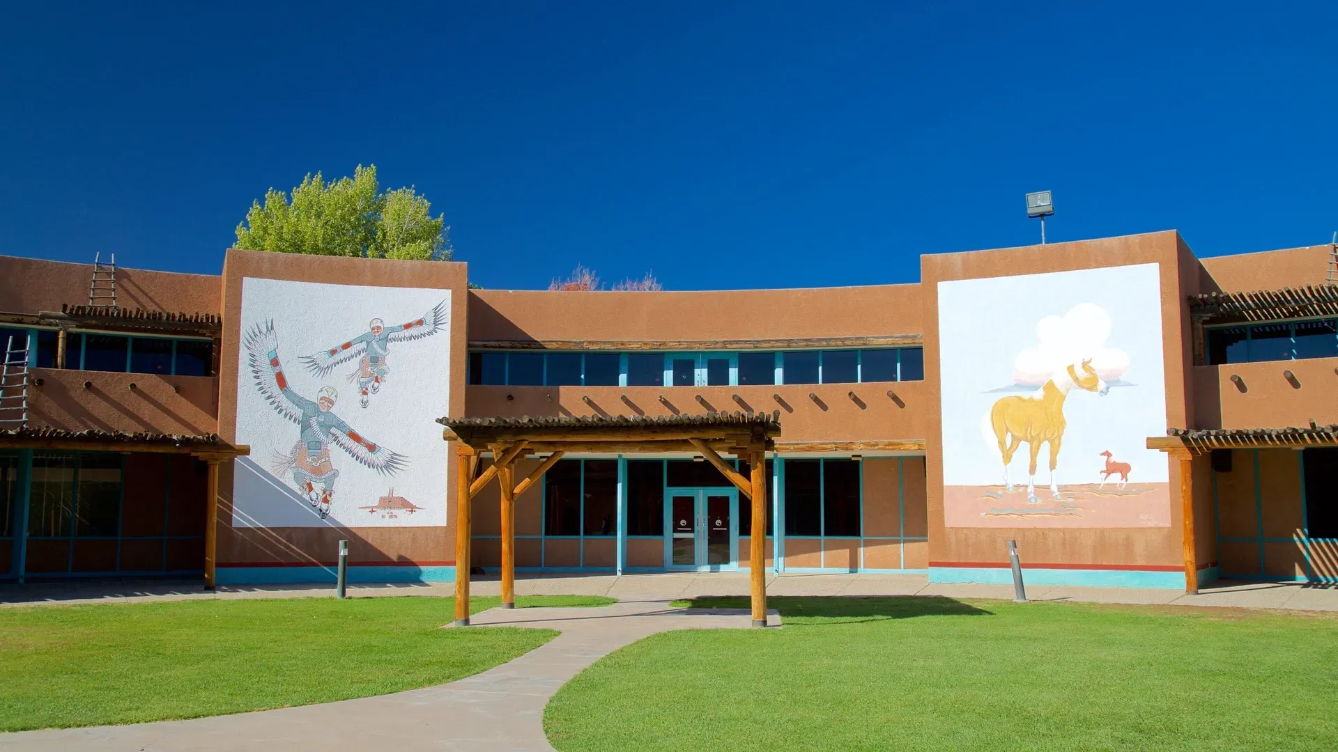 Colorful Pueblo murals on the exterior walls of the Indian Pueblo Cultural Center Albuquerque