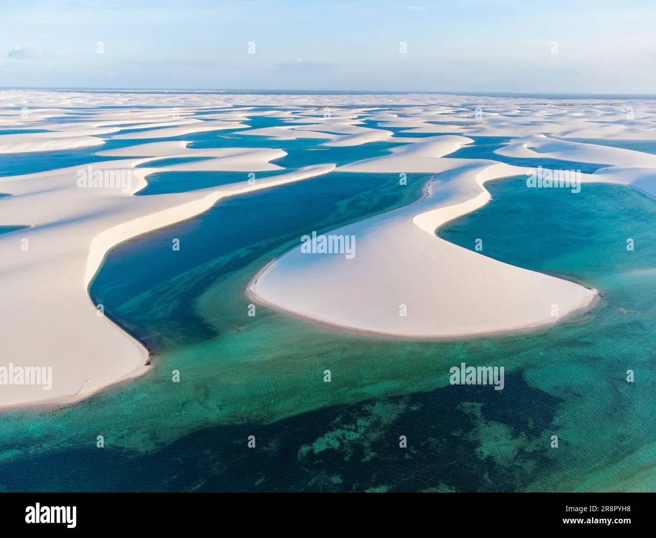 Aerial view of turquoise lagoons and white sand dunes at Lençóis Maranhenses