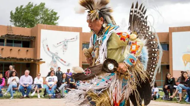 Native American dancer in traditional regalia performing at the Indian Pueblo Cultural Center Albuquerque