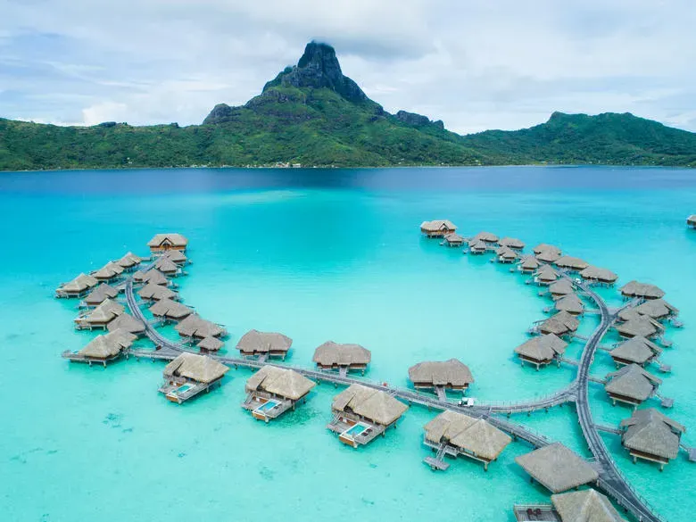Presidential overwater bungalows at Intercontinental Bora Bora resort connected by walkways