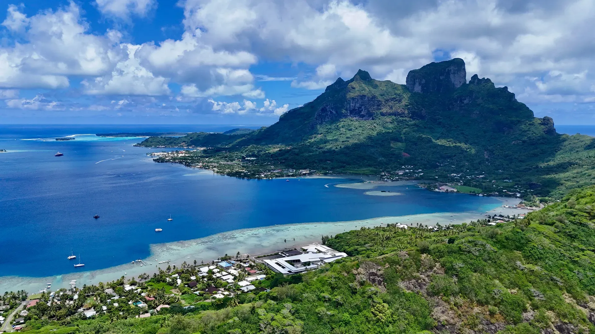 Aerial view of Bora Bora French Polynesia lagoon with vibrant blue waters