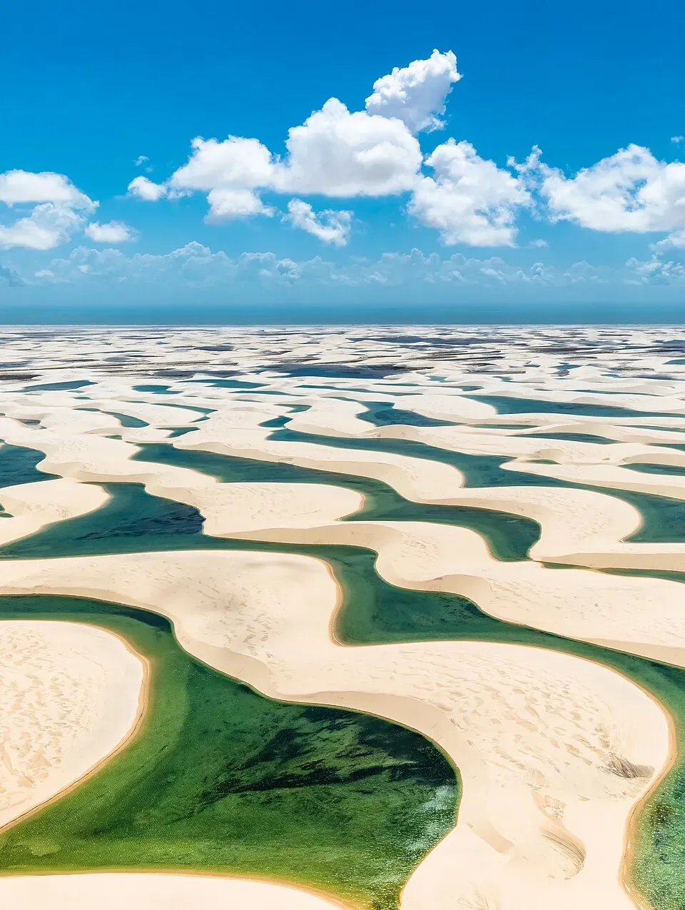 White sand dunes with turquoise lagoons at Lençóis Maranhenses Brazil