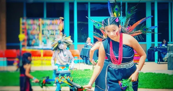 Young Pueblo dancer in feathered headdress at the Indian Pueblo Cultural Center Albuquerque