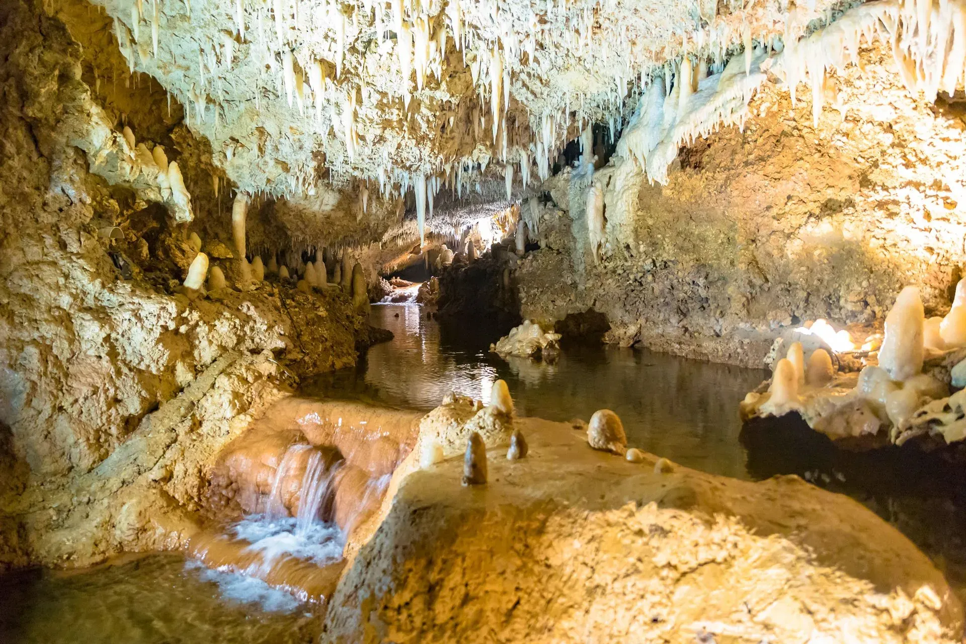 Underground stream in Harrison's Cave Barbados flowing past stalactites and stalagmites