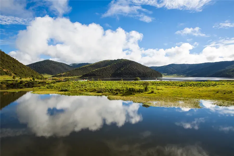 Highland lake reflecting clouds