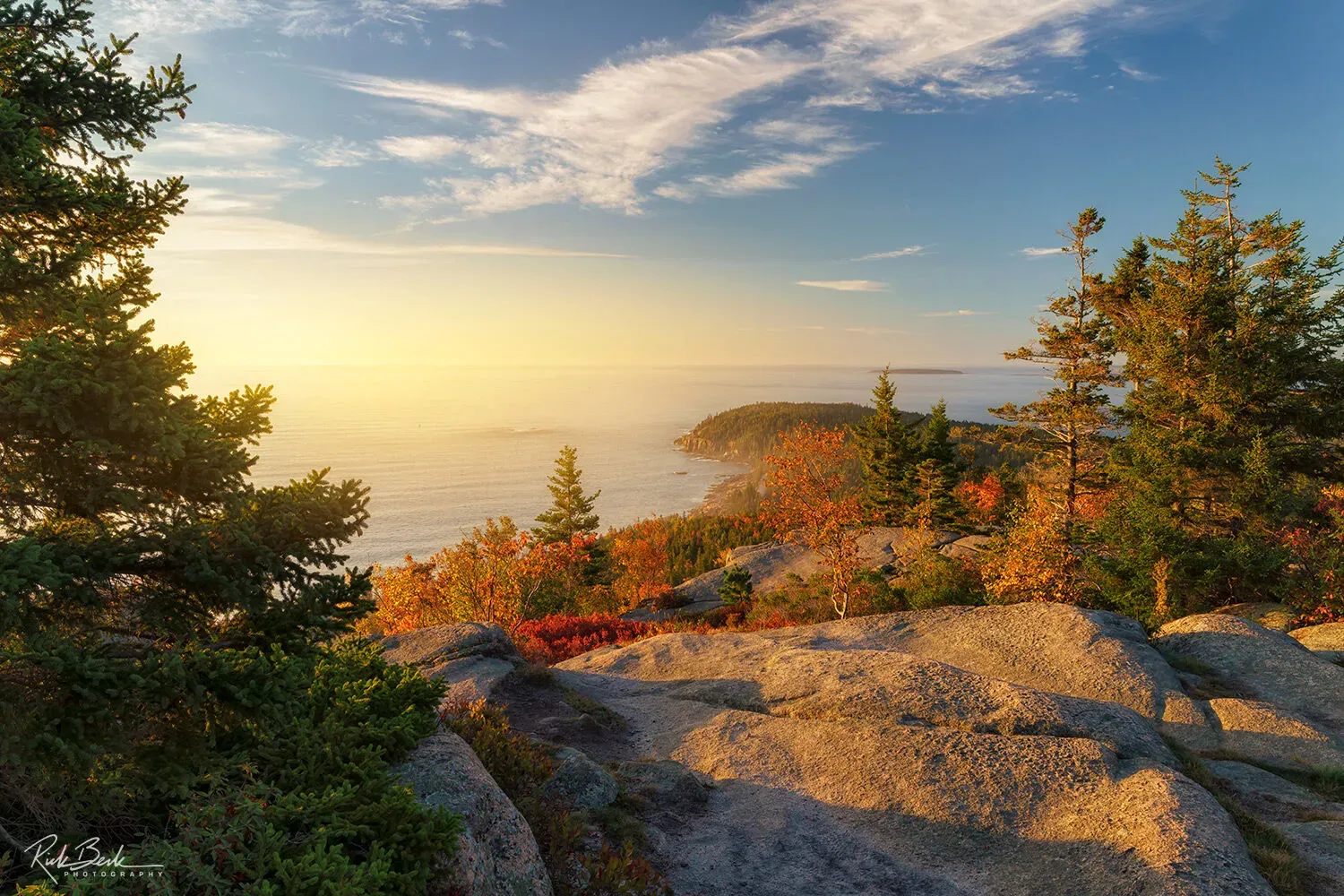 Autumn colors on Gorham Mountain with rocky coastline in Acadia National Park United States