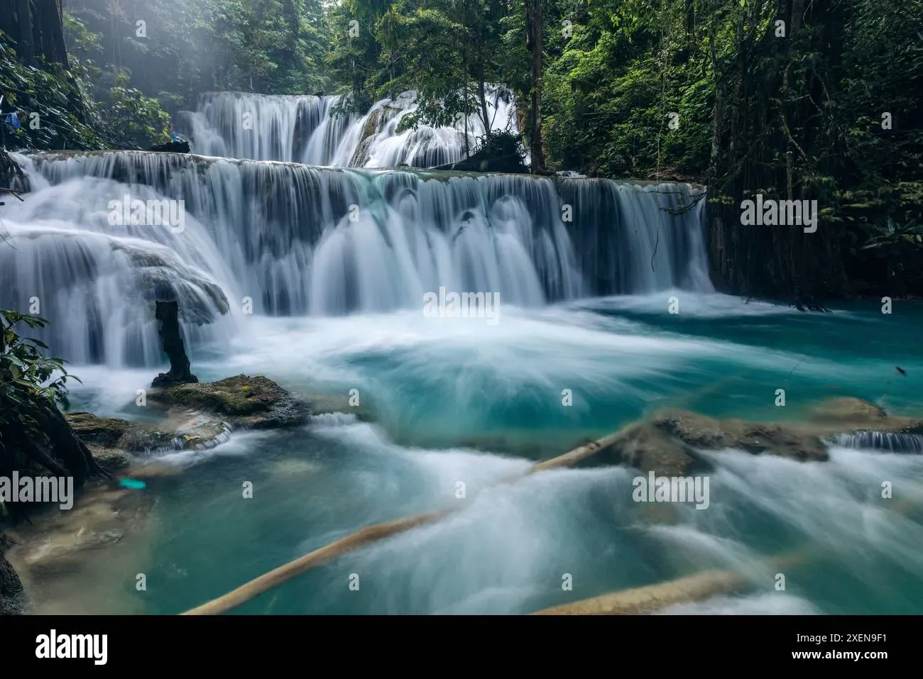 Long exposure of Piala waterfall cascading over rocky steps