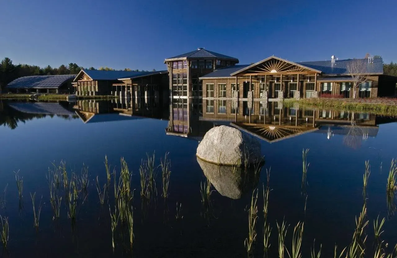 Modern museum building reflected in pond