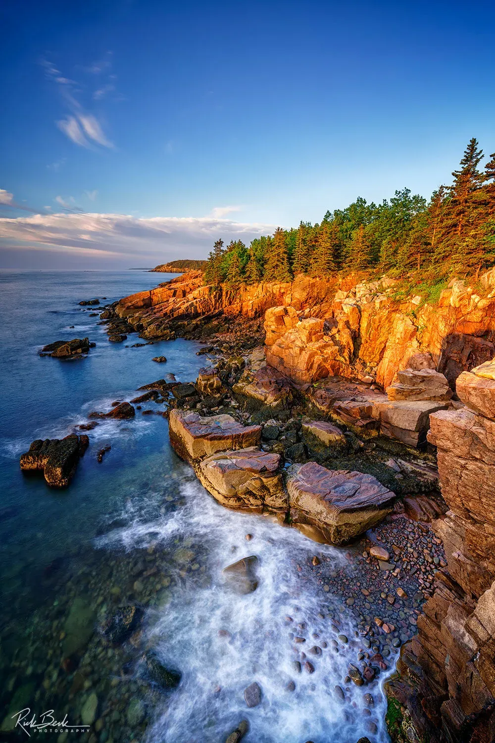 Rugged rocky coastline of Acadia National Park United States in golden morning light