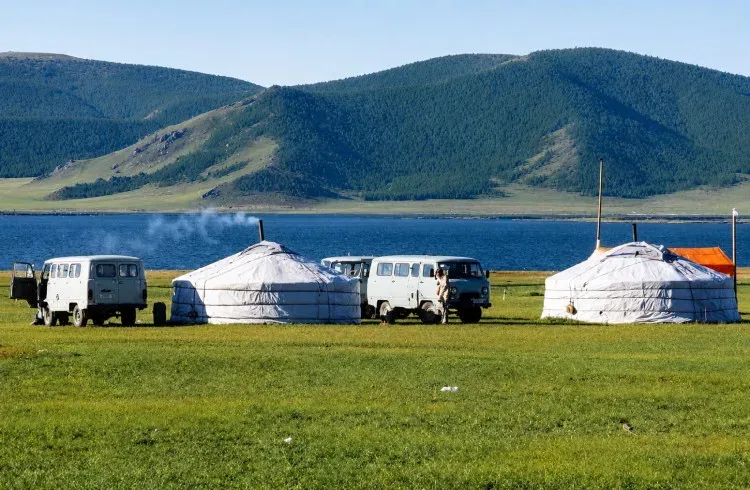 Terkhiin Tsagaan Lake in Mongolia with traditional yurts on the shore