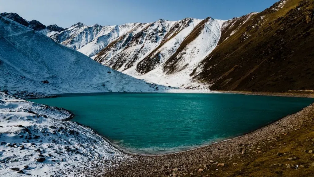 Snow-covered shoreline of Kol Tor Lake