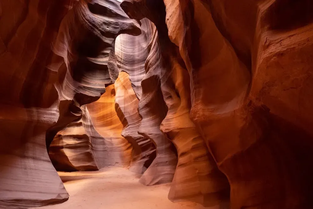 Sunlight beams filtering through narrow openings in Lower Antelope Canyon Page Arizona