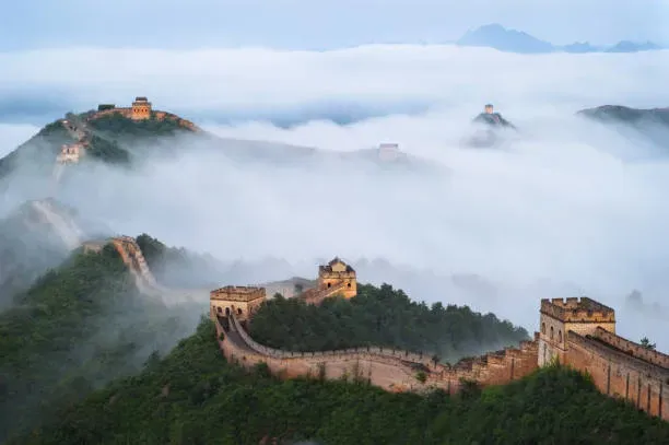 Great Wall of China at Jinshanling section shrouded in dramatic clouds and mist