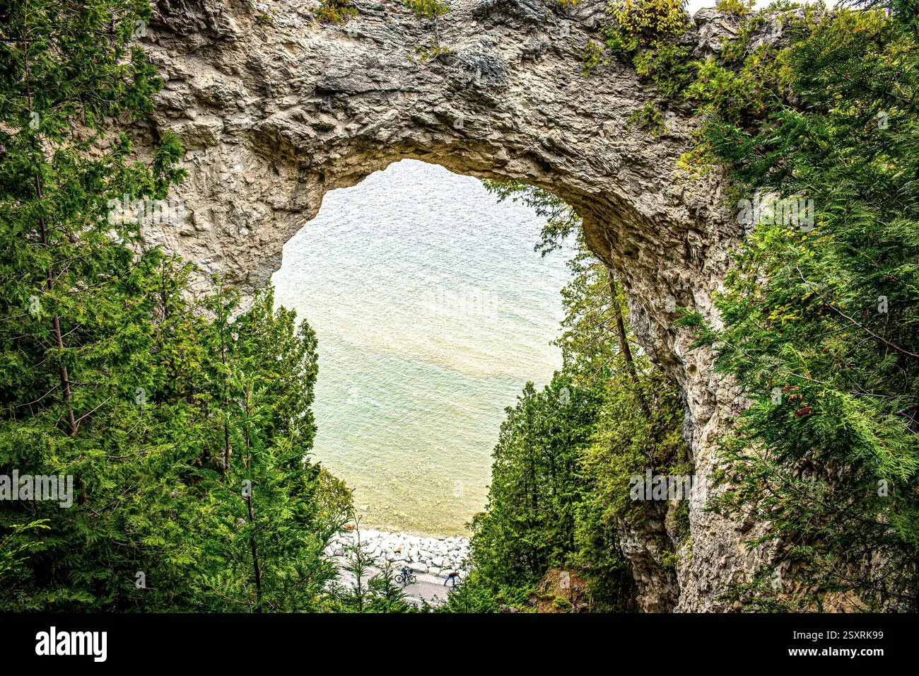 Visitors at Arch Rock Mackinac Island Michigan, a natural limestone arch