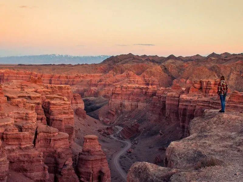 Visitor at rocky overlook in Charyn Canyon Kazakhstan