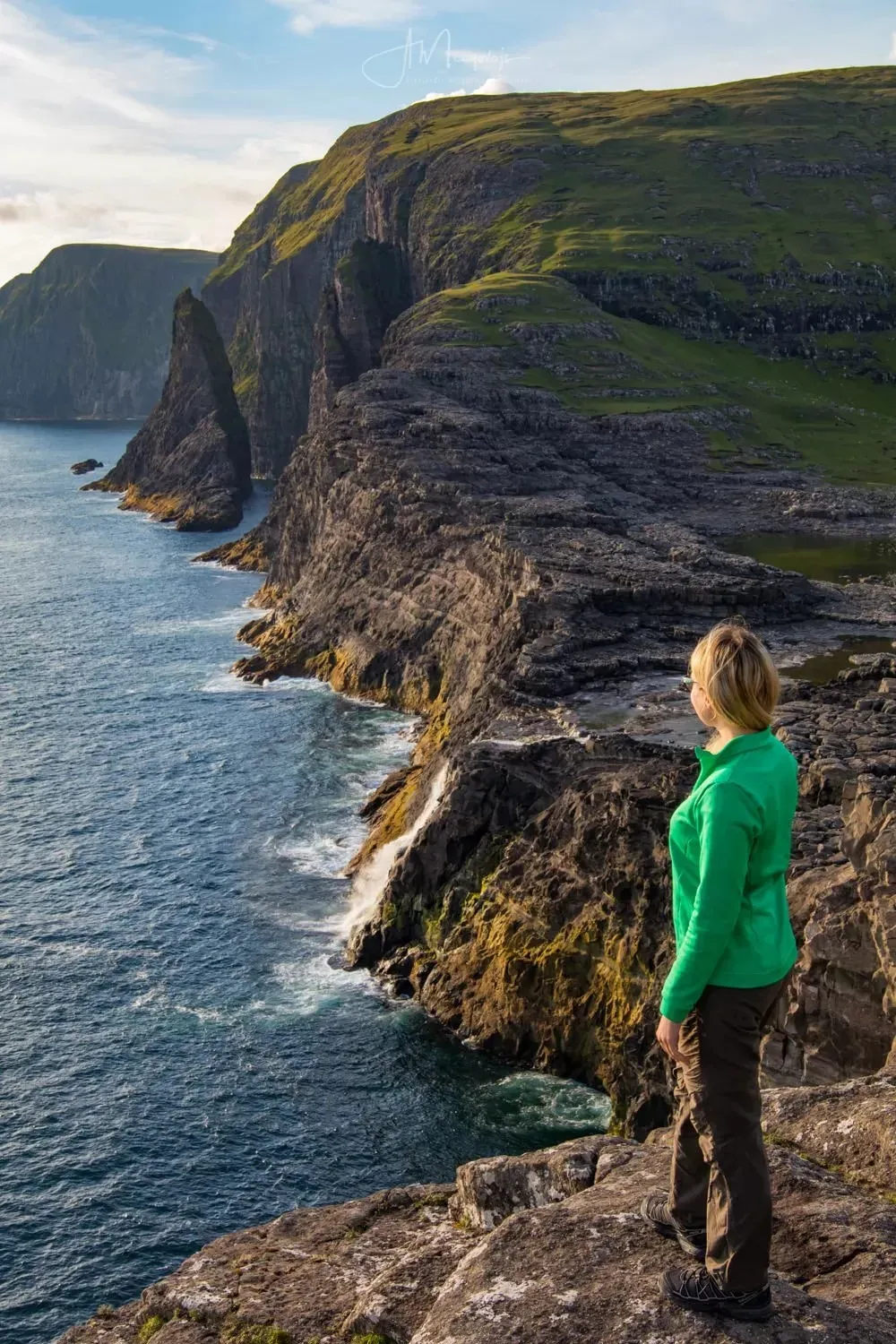Bøsdalafossur waterfall cascading from Lake Sørvágsvatn into the North Atlantic Ocean