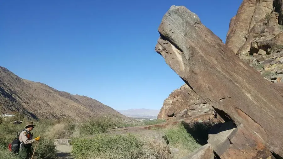 Rugged desert canyon landscape in Tahquitz Canyon with rock formations and sparse vegetation