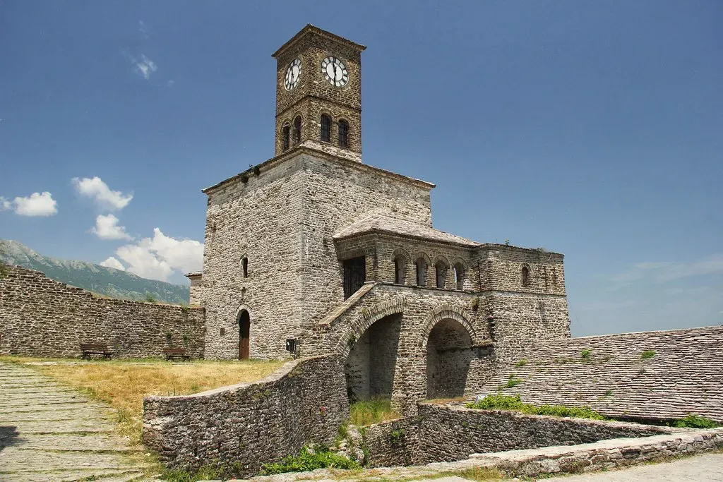 Historic stone clock tower with arched entrance at Gjirokastra Castle Albania