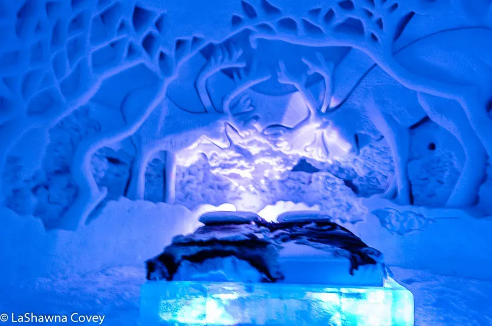 Ice bedroom with carved walls at Tromsø Ice Domes hotel