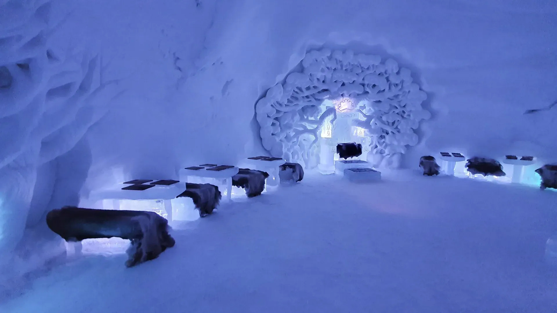 Illuminated ice archway inside Tromsø Ice Domes