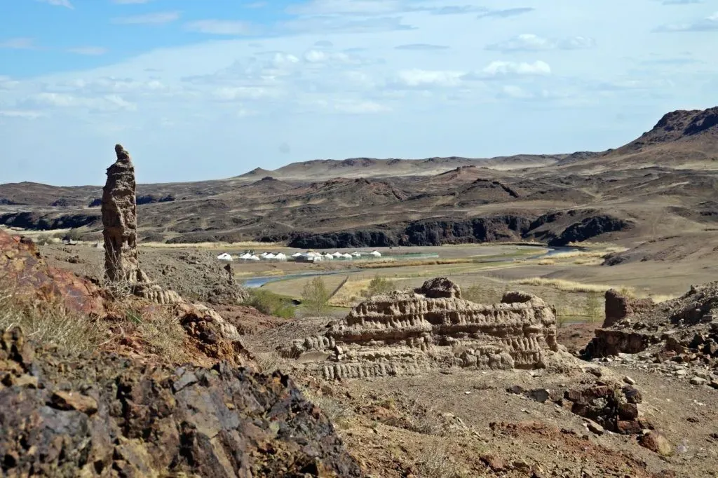 Ongi Monastery Mongolia ruins across the Ongi River valley with distant mountains beyond