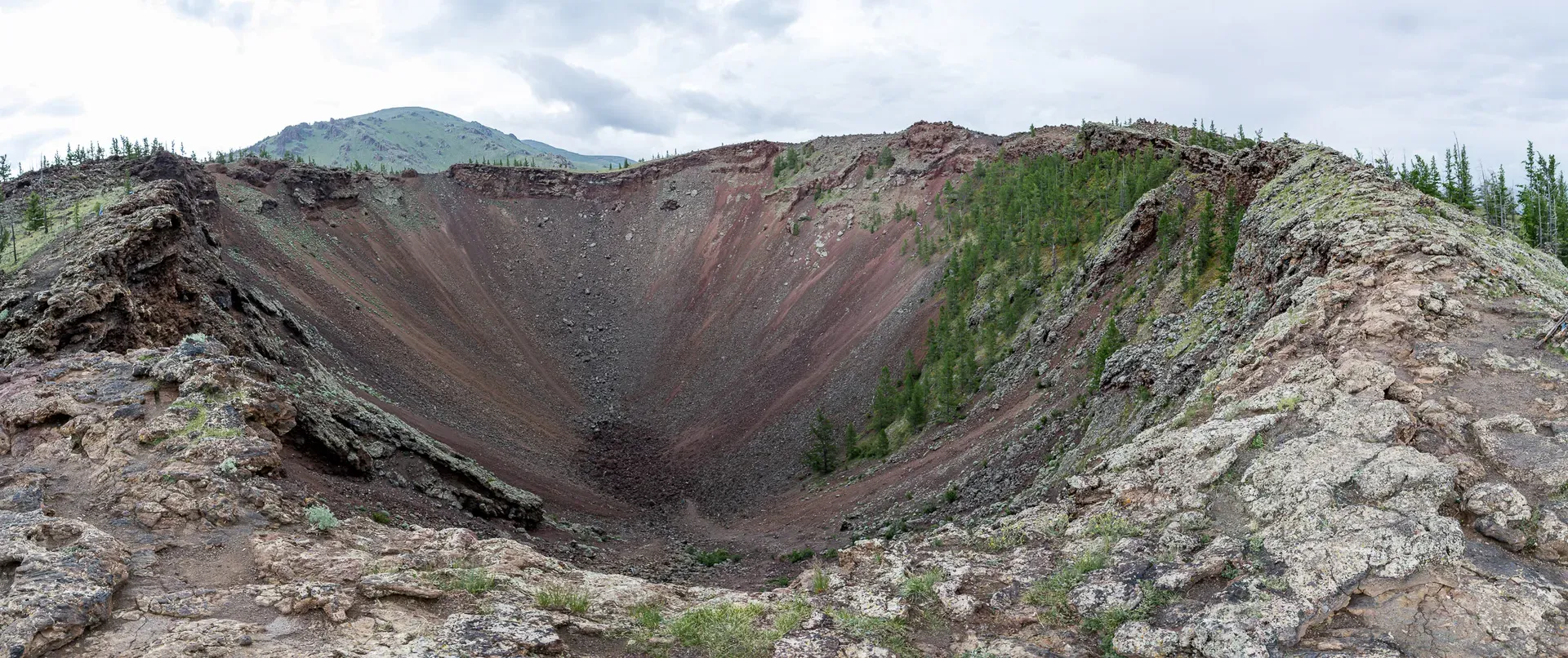 Panoramic view of Khorgo volcano crater rim with Terkhiin Tsagaan Lake in the distance