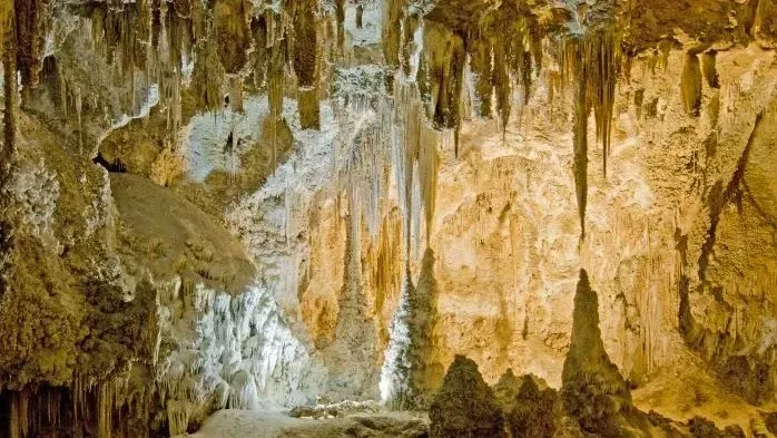 Stalactites and stalagmites creating a dramatic underground landscape inside Grutas de Nombre de Dios Chihuahua
