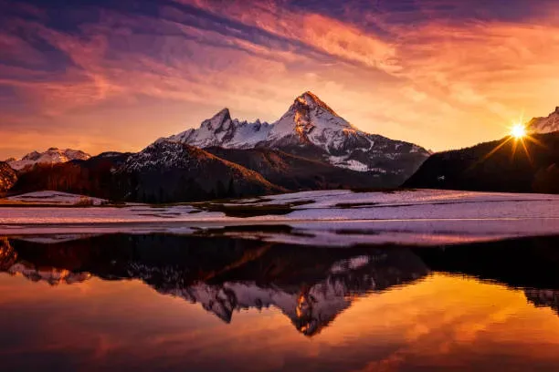 Sunset casting golden light over the Patagonian mountains near Cueva de las Manos