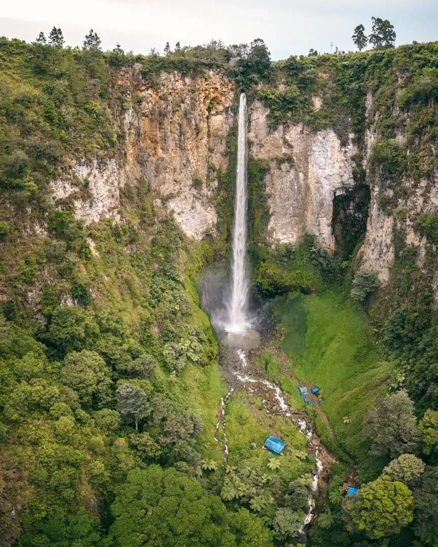 Panoramic view of Sipiso Piso Waterfall with Lake Toba visible in the background