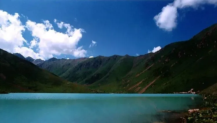 Chatyr-Kul alpine lake surrounded by mountains near Tash Rabat, Kyrgyzstan, near the Chinese border