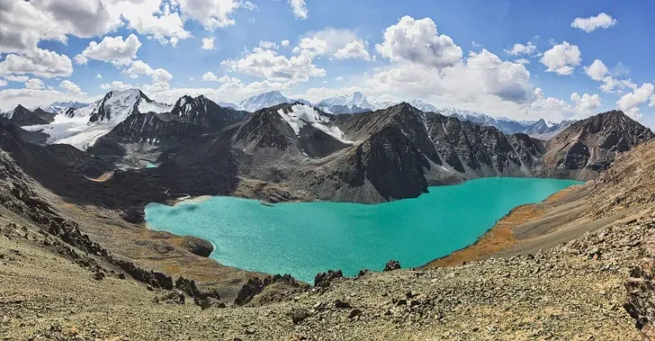 Spectacular view of Ala-Kul Lake Kyrgyzstan turquoise glacial waters nestled in the rugged Terskey Ala-Too mountains