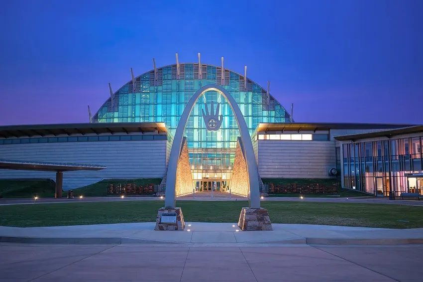 First Americans Museum in Oklahoma City United States at dusk with illuminated glass dome and entrance