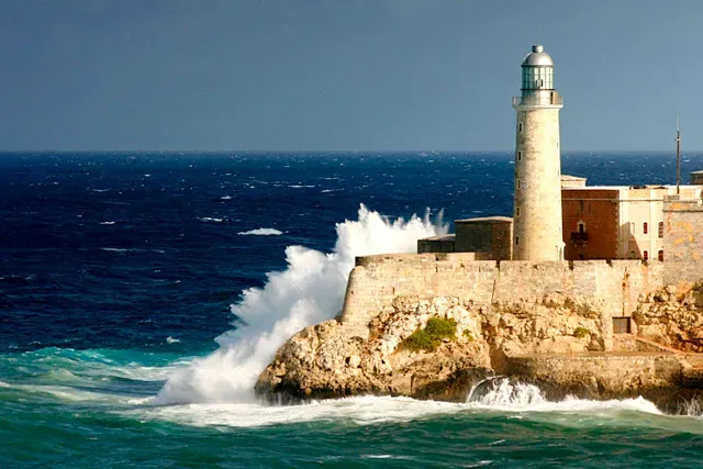 El Morro Castle lighthouse on Havana Cuba's rocky coastline overlooking Caribbean waters