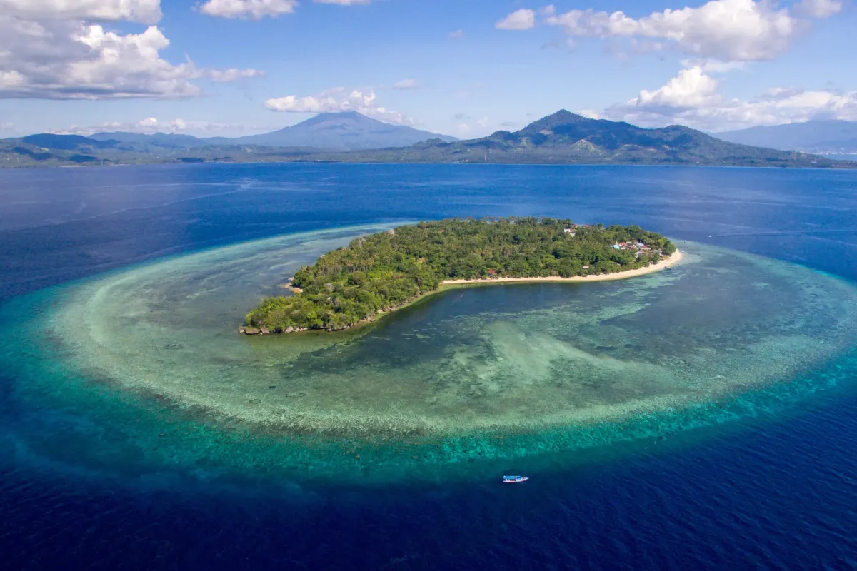 Aerial view of Siladen Island in Bunaken National Park Indonesia surrounded by turquoise waters and coral reefs