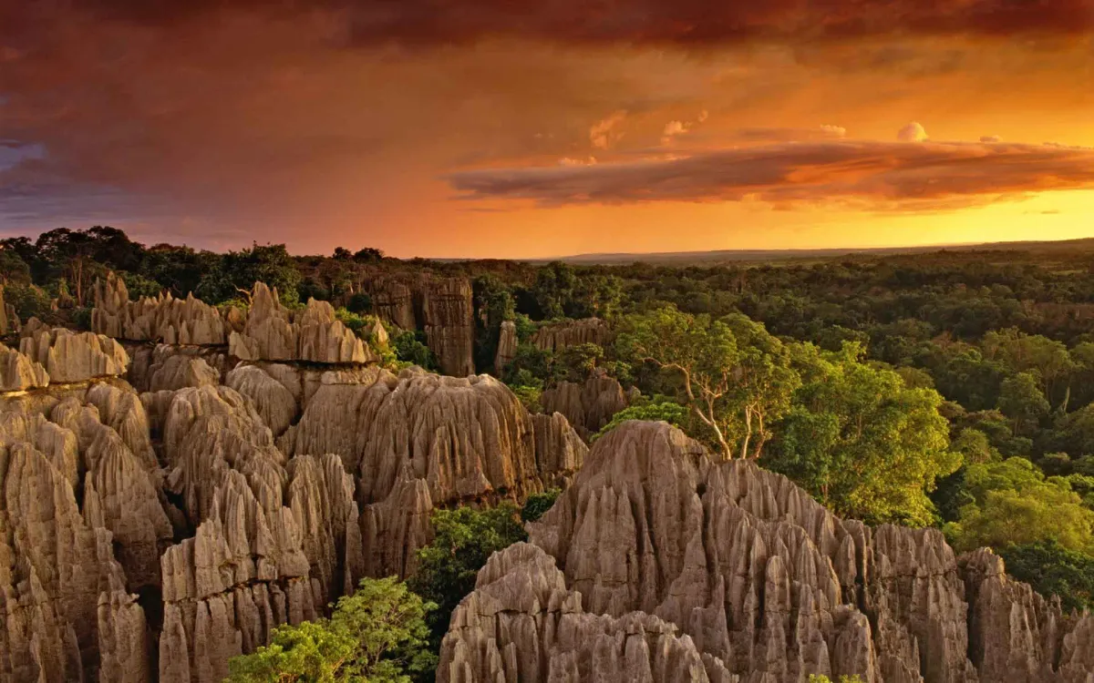 Dramatic sunset over Tsingy de Bemaraha National Park's razor sharp limestone formations in Madagascar