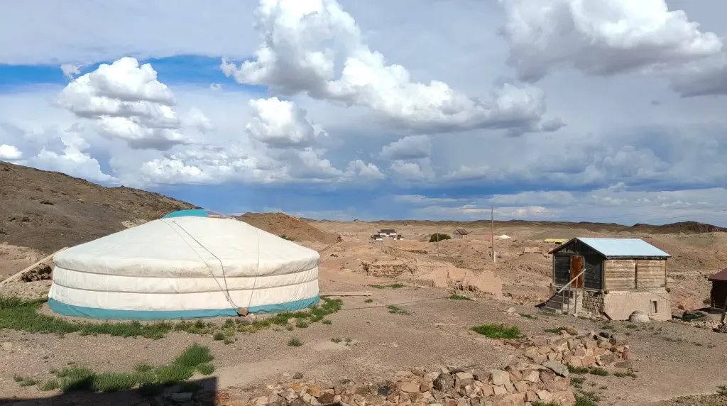 Panoramic view of Ongi Monastery Mongolia ruins set against rolling hills of the Gobi steppe
