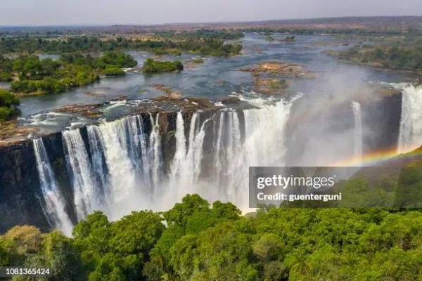 Aerial view of Victoria Falls Zimbabwe showing Mosi-oa-Tunya thundering cascades with rainbow