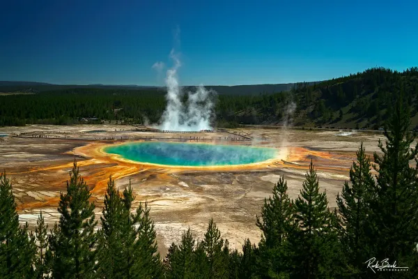 Aerial view of Grand Prismatic Spring showing blue, green, and orange thermal colors