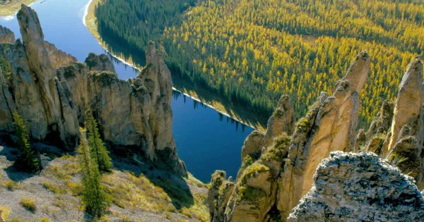 Dramatic limestone pillars of Lena Pillars Nature Park rising along the Lena River in Yakutia Siberia