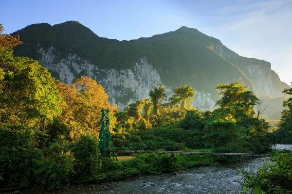 Limestone karst mountains rising above a rainforest valley at Gunung Mulu National Park in Sarawak, Malaysia