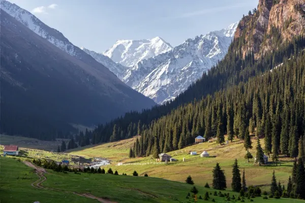 Altyn Arashan Kyrgyzstan valley panorama with green meadows and Tien Shan mountains