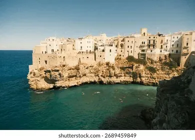 Panoramic view of Wadi Al Arbaeen in Oman with turquoise pools set between canyon walls and palm groves