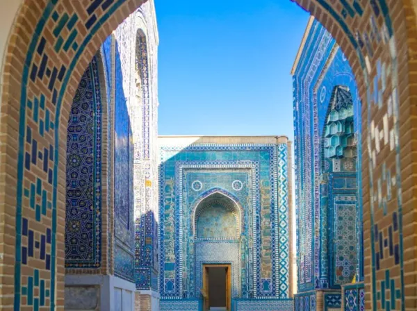 Blue and turquoise tilework archway at Shah-i-Zinda necropolis in Samarkand, Uzbekistan