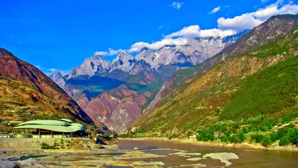 Snow-capped Haba Snow Mountain towering above Tiger Leaping Gorge China with winding Jinsha River below