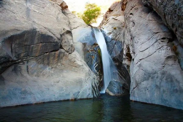 Tahquitz Falls, a 60-foot seasonal waterfall spilling into a deep pool in Tahquitz Canyon, Palm Springs